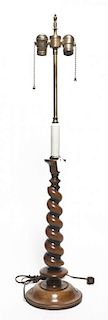 An English Turned Walnut Candlestick, Height overall 34 1/4 inches.