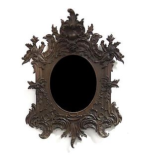 A Victorian Carved Oak Mirror, Height 36 x 25 1/4 inches.
