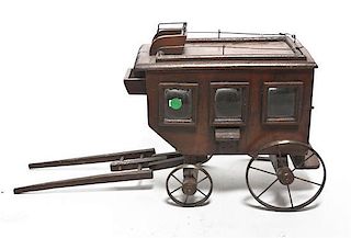A Painted Wood Model of a Coach, Length 23 inches.