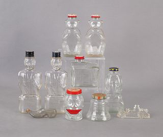 Collection of glass banks and ink bottles, tallest