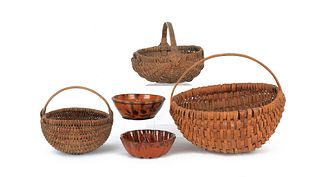 Three woven baskets, together with two redware mol