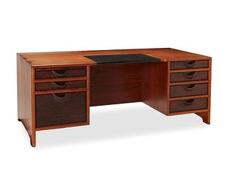 John Nyquist (1936-2018), A teak and rosewood desk, circa 1976, 28" H x 72" W x 33.25" D