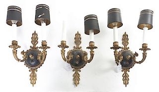 A Set of Three Empire Style Gilt and Patinated Metal Two-Light Sconces, Height of each overall 15 1/4 inches.