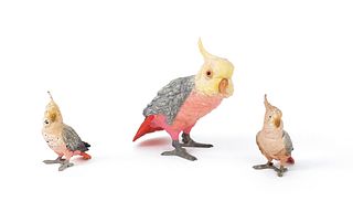 Three cockatiels, mid 20th c., two - 4" h., one -/