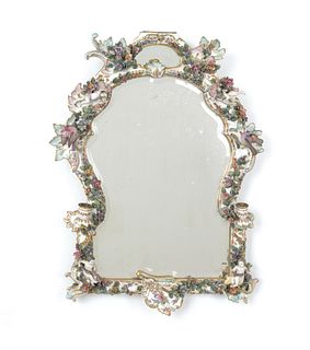 Porcelain mirror with floral and putti decoration,