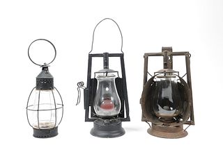 Three tin lanterns to include two Dietz examples,a