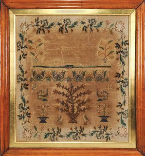 Silk on linen sampler, 19th c., with a floral bord