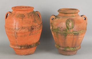 Two massive terra cotta urns, 35" h. and 36" h.