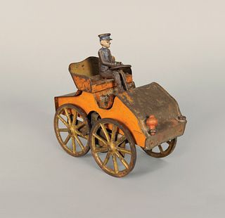 Painted pressed steel hill climber, ca. 1900, 7" h