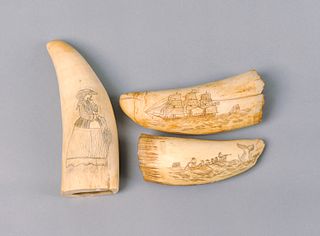 Three scrimshaw decorated whale teeth.