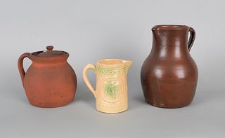 Redware pitcher, 19th c., 10" h., together with ae