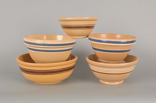 Five yelloware mixing bowls, largest - 5" h., 12 1
