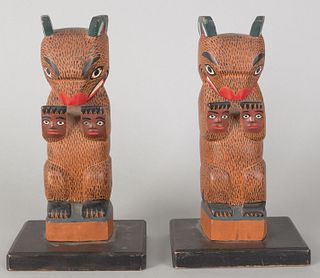 Pair of Northwest Coast carved and painted totems,