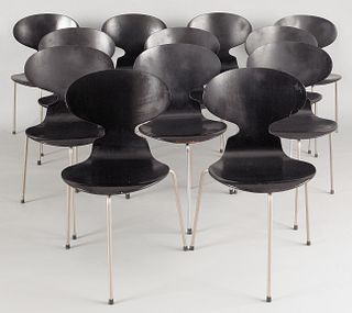 Set of twelve modern black stacking chairs.