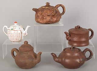 Four Chinese pottery teapots, together with a porc