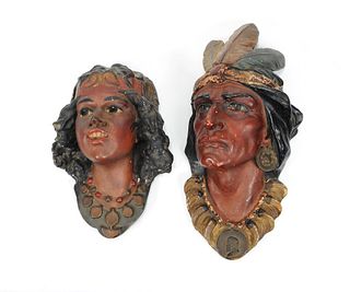 Three painted plaster masks of Native Americans, e