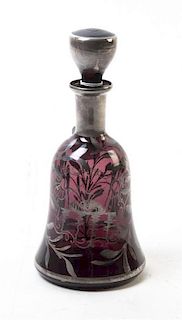 A Bohemian Silver Overlay Plum Glass Bottle and Stopper, Height 9 inches.