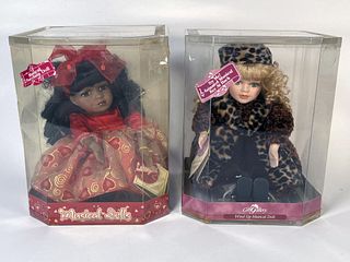 2 MUSICAL PORCELAIN DOLLS IN BOXES
