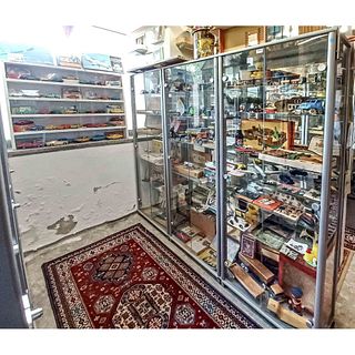 Four display cases with GDR toy