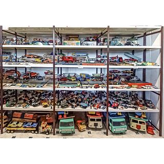 Three shelves with GDR toys aro