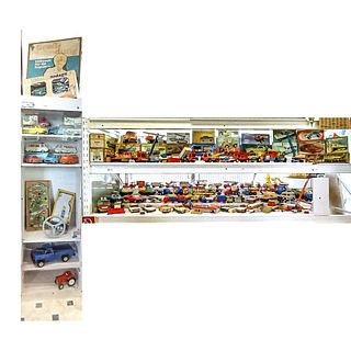 Two shelves with GDR toy cars a