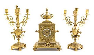 A French Gilt Bronze Three-Piece Clock Garniture, Height of candelabra 16 1/2 inches.