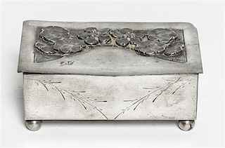 A French Art Deco Pewter Music Box, the design by Romain de Tirtoff Erte (Russian, 1892-1990), Width 5 inches.