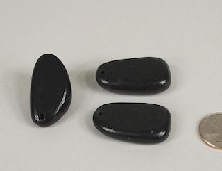 Three Chinese Carved Black Jade Pebble Pendants