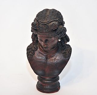 A Carved Wood Bust of a Woman.