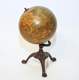 A Vintage Gloge with A Metal Base.