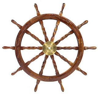 A Mahogany and Brass Ship Wheel, Diameter 45 inches.