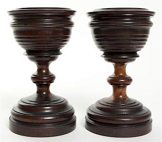 A Pair of Turned Hardwood Urns, Height 8 1/2 inches.