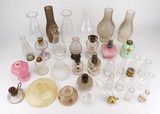 Lot of oil lamps, shades and hurricanes