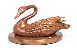 A Carved Wood Figure of a Swan, Height 15 x width 26 inches.