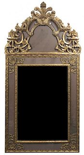 An Italian Neoclassical Mirror, Height 60 1/2 x width 29 3/4 inches.