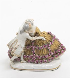A Continental Porcelain Figural Group, Height 5 inches.