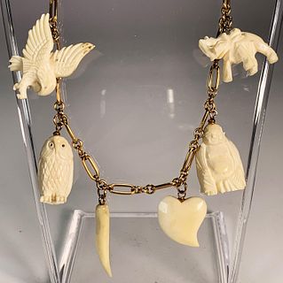 CARVED ANIMALS & SYMBOLS NECKLACE ON 12K GOLD FILLED CHAIN