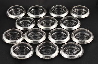 Fourteen Whiting Sterling and Cut Glass Coasters