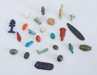 GROUP OF EGYPTIAN STONE AND FAIENCE AMULETS AND SCARABS