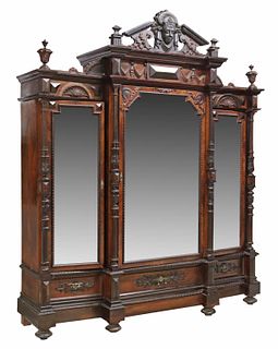 VICTORIAN CARVED MIRRORED THREE-DOOR ARMOIRE