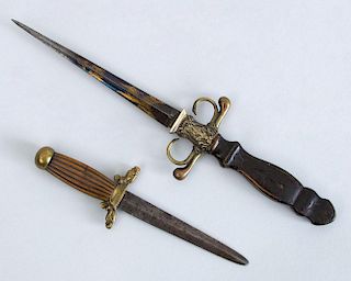 TWO DECORATIVE BRASS-MOUNTED WOOD AND METAL DAGGERS