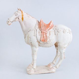 TANG UNGLAZED PAINTED POTTERY FIGURE OF A SADDLED HORSE