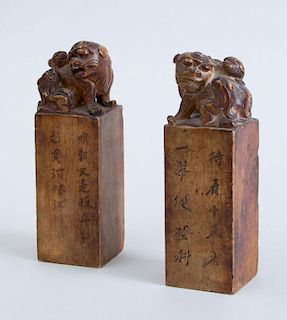 PAIR OF CHINESE CARVED SOFTSTONE CHOPS WITH FU DOGS AND PUPS