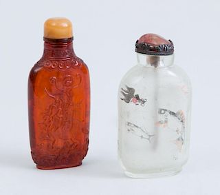 CHINESE INTERIOR-PAINTED QUARTZ SNUFF BOTTLE AND STOPPER, AND AN AMBER-COLORED BOTTLE AND STOPPER