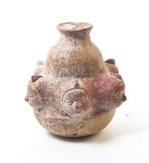 A Pre-Columbian Style Gourd Form Vessel, Height 8 1/4 x width 7 inches.