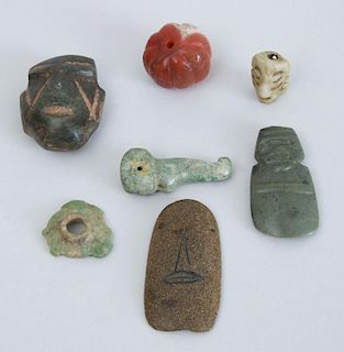 GROUP OF INDONESIAN AND OCEANIC CARVED STONE PENDANTS