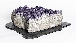 An Amethyst Crystal Specimen. Height 5 1/2 x width 19 1/2 inches.