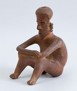 NAYARIT PROTOCLASSICAL RED-GROUND POTTERY SEATED FIGURE OF A MAN