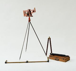 STAINED WOOD AND BRASS-MOUNTED SURVEYING TOOL ON A TRIPOD BASE