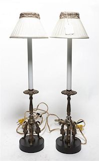 A Pair of Neoclassical Brass Candlesticks, Height overall 27 inches.